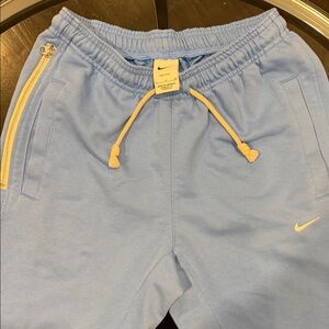 Nike Light Blue Joggers with Yellow Accents